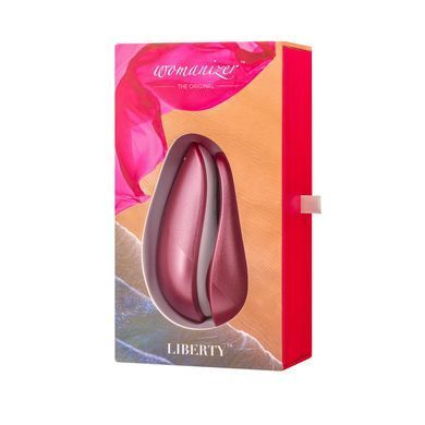 Вакуумний кліторальний стимулятор Womanizer Liberty Pink, магнітна кришка, 2 насадки &mdash; купити в інтим-бутику EroticToys